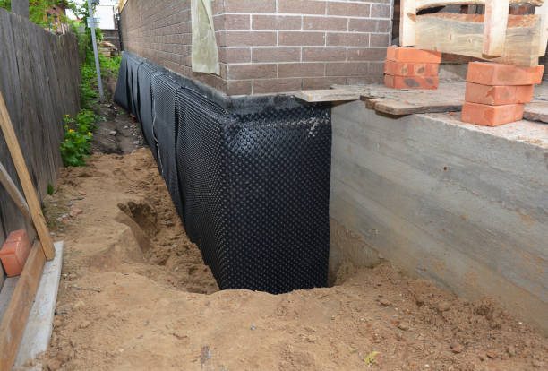 Happy homeowners after waterproofing job in Croton